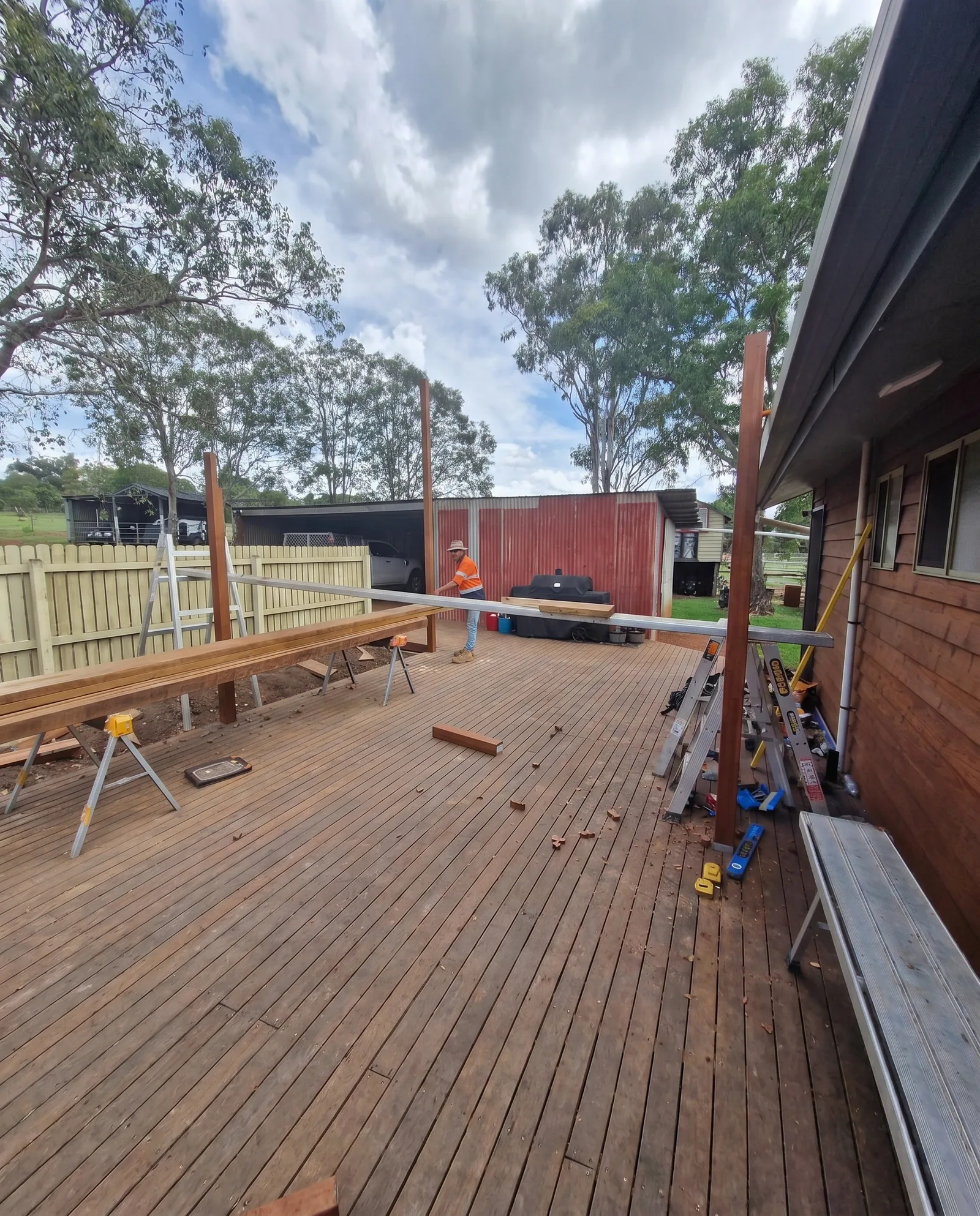 Quality Custom Homes crew building a deck