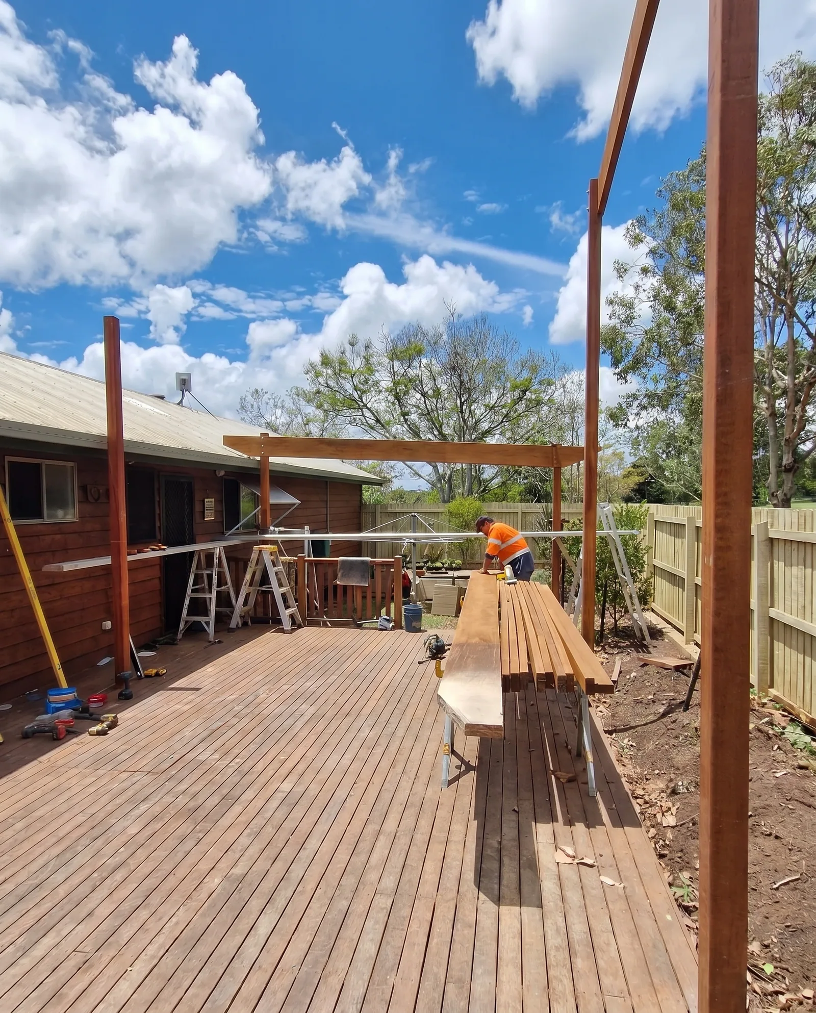 Worker framing a pergola